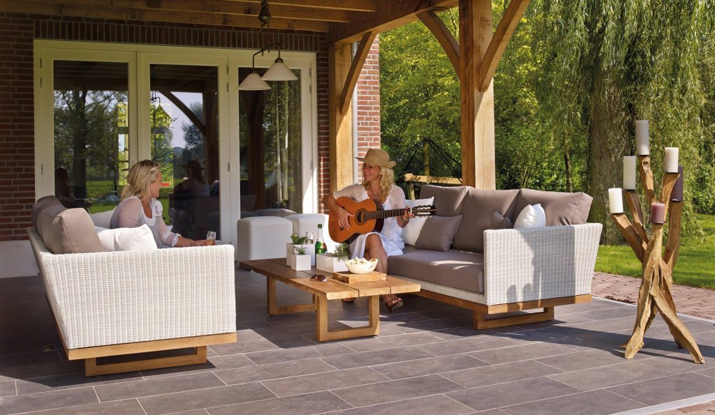 Two Women Sitting on Sofas on Extended Porch