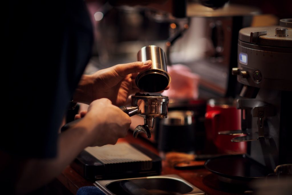 Close up Barista making cappuccino, bartender preparing coffee d