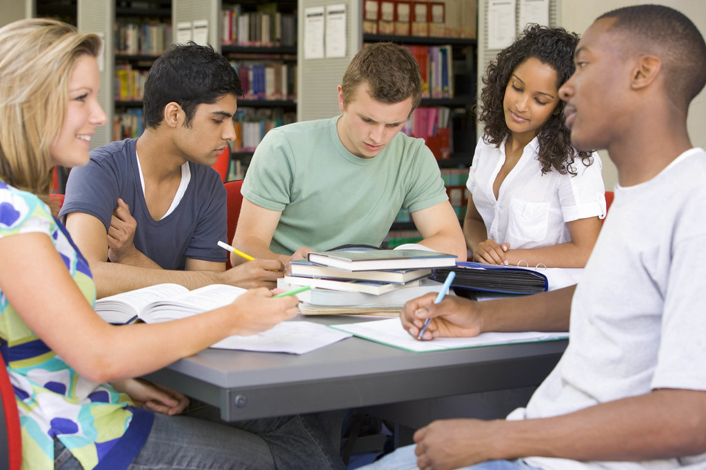 College students studying together in a library