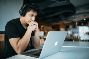 A man watching a video on the laptop. 