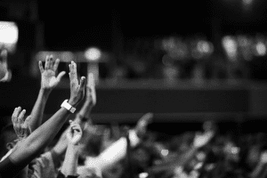 Hands waving during a church mass 