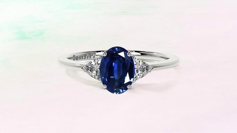 three-stone ring. keep sapphire as a centerstone and diamonds as side stones