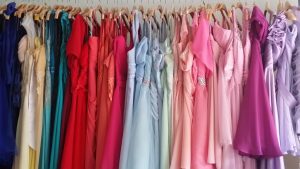 big rack of colorful dresses