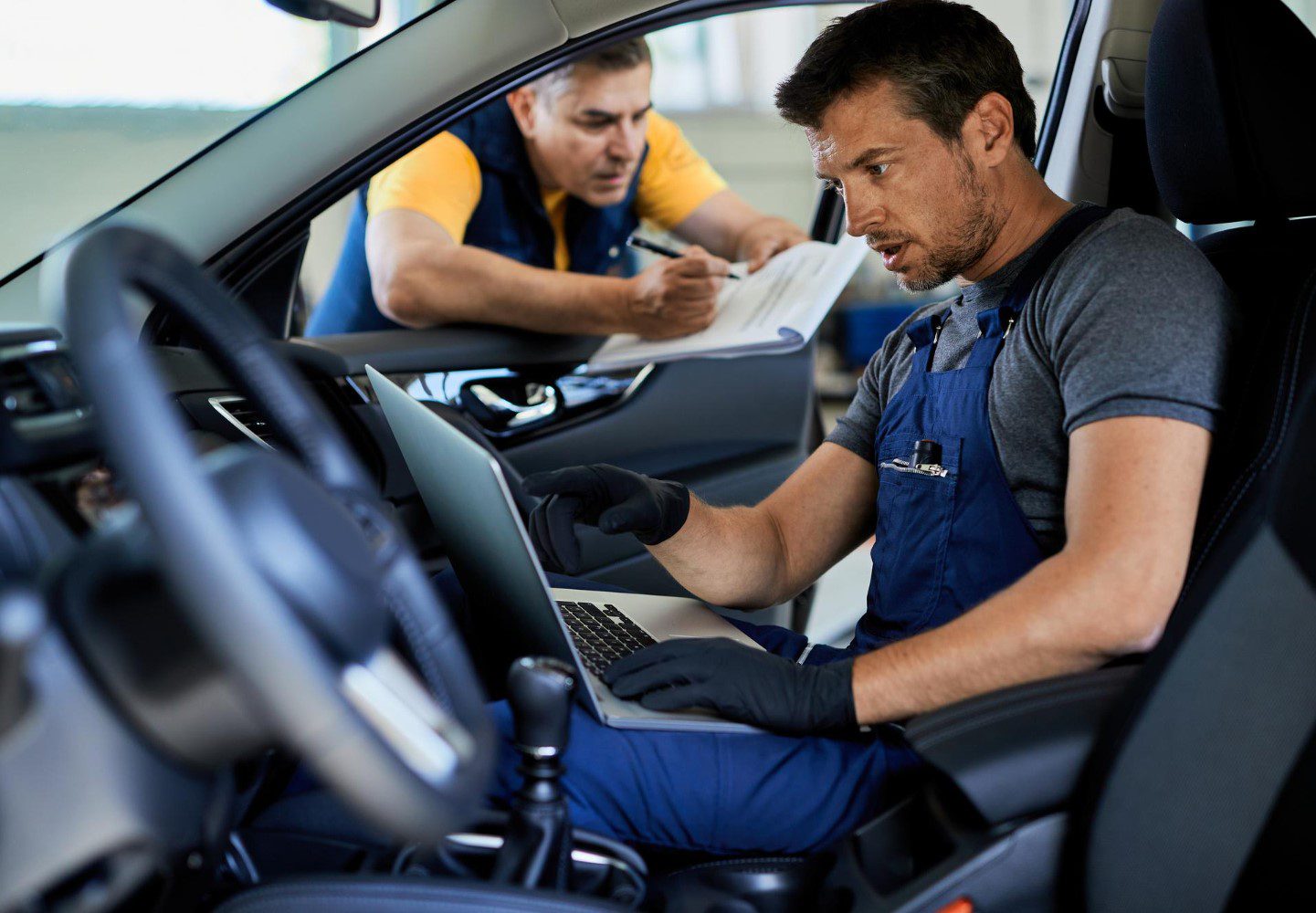 Man working on car security upgrades